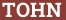 Brick with text TOHN